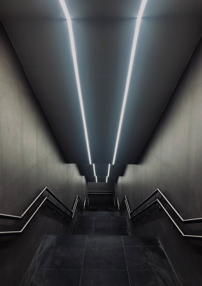 pexels-photo-6584871 Lighted Gray Concrete Staircase With Stainless Steel Railings